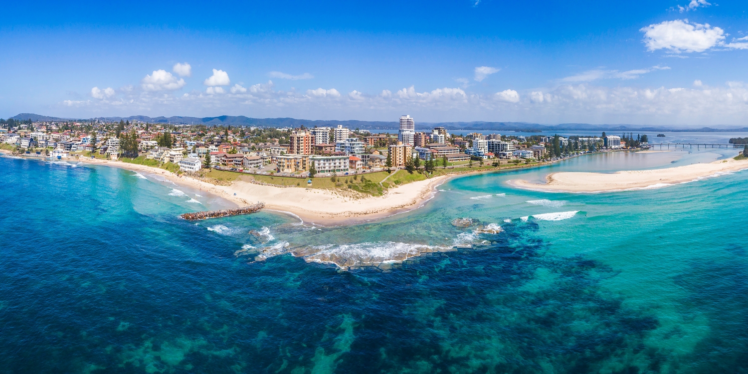 Aerial view of The Entrance coastline, beaches and Tuggerah Lake on the NSW Central Coast.