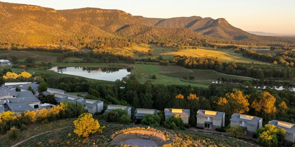 Scenic view across vineyards and countryside in the Hunter Valley wine region of New South Wales.